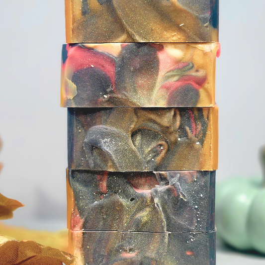 Artisan soaps in vibrant colors featured in the Fall Essentials Guide for women with dry skin
