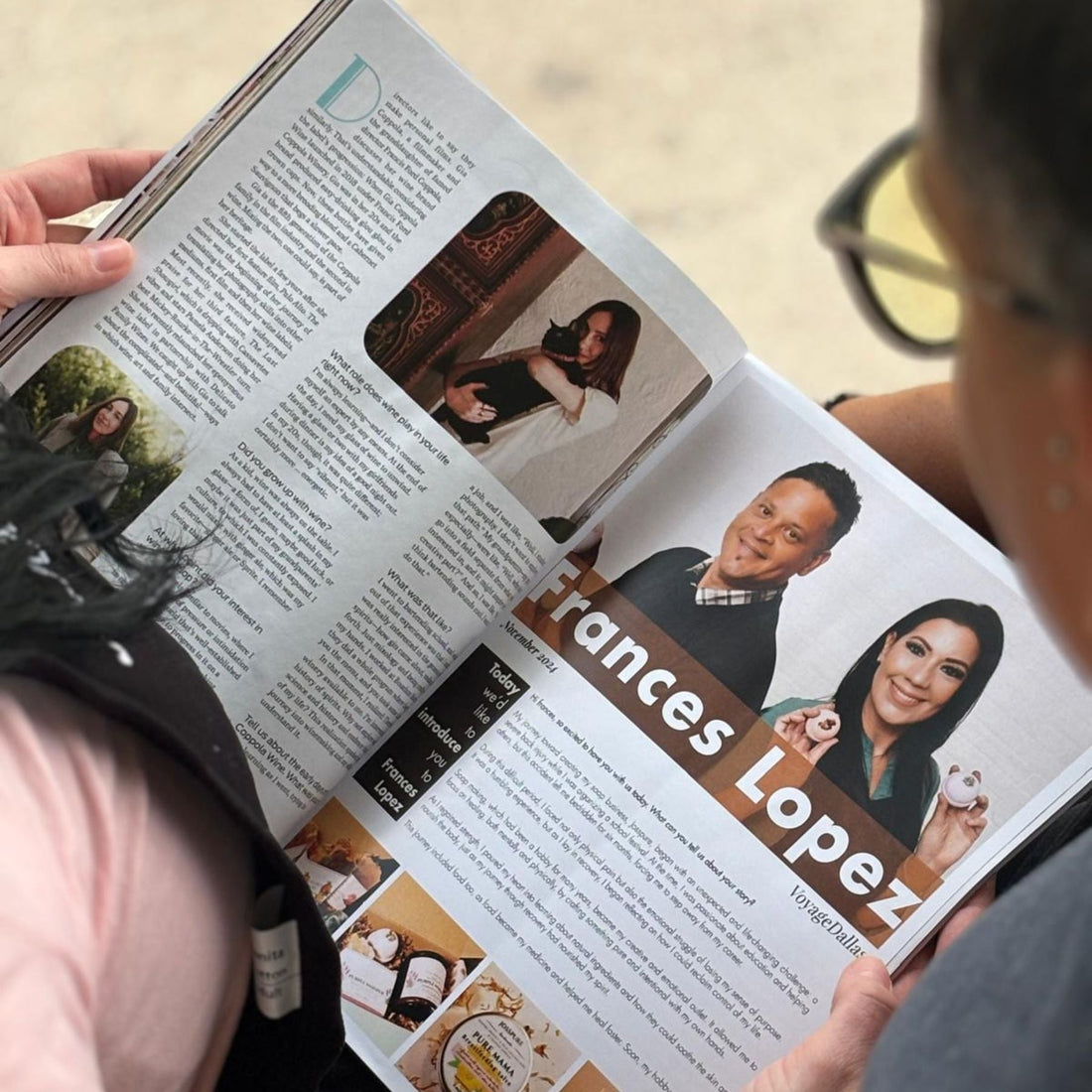 Person reading a magazine article about Josspure featured in voyage dallas magazine with images of founders and product shots