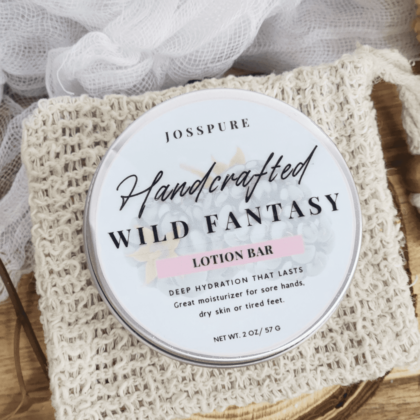 JOSSPURE handcrafted Wild Fantasy blackberry sage travel size mini lotion bar on a woven pouch
