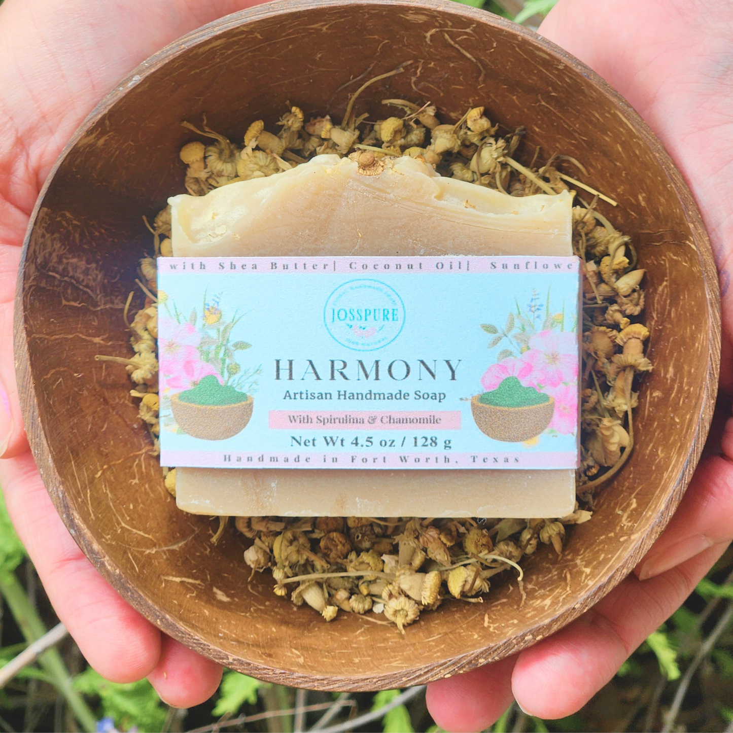 Green All Natural Soap Harmony artisan handmade bar with spirulina and chamomile on dried flowers