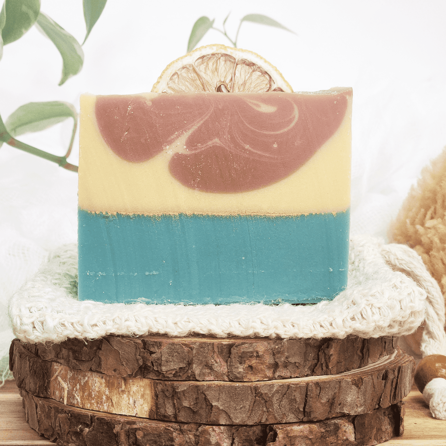 JOSSPURE handmade lemongrass mild shea butter soap with layered colors and natural dried lemon slice