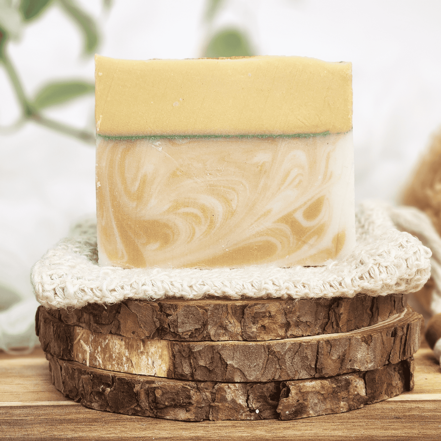 JOSSPURE lemongrass mild shea butter soap bar with natural swirls displayed on wooden and crocheted holders