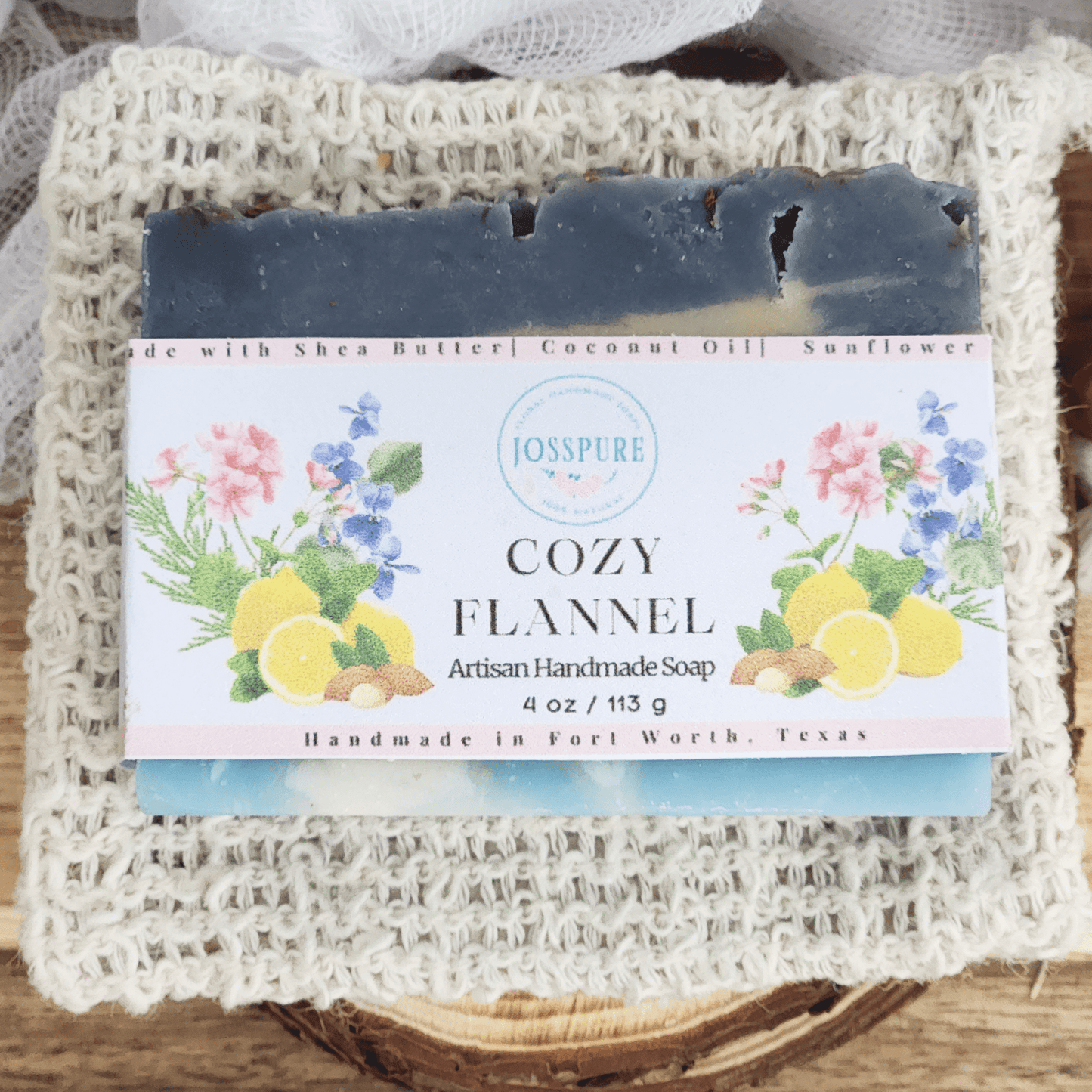 JOSSPURE flannel mild shea butter soap with natural ingredients wrapped in decorative label on textured cloth
