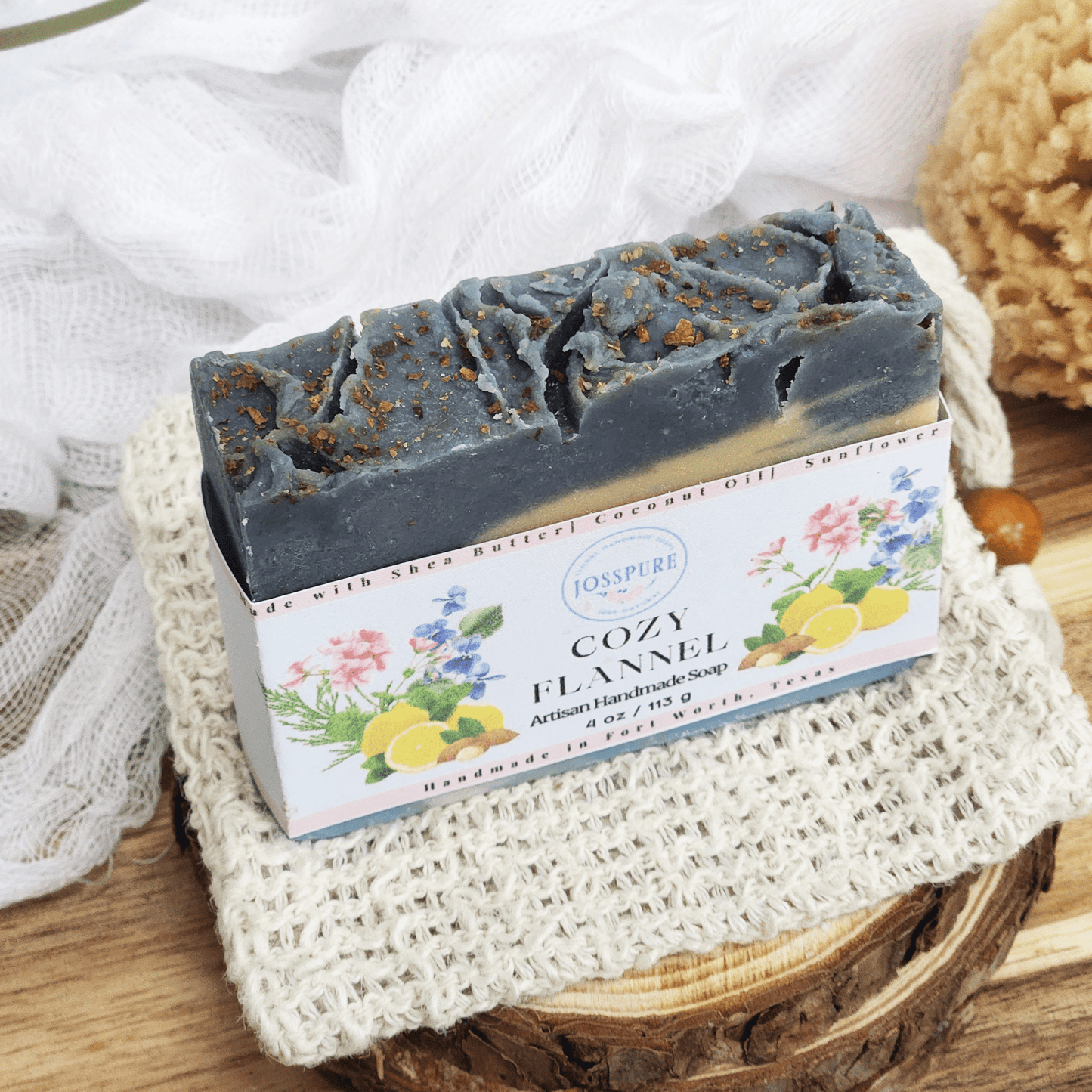 JOSSPURE flannel mild shea butter soap bar with natural ingredients on a textured cloth