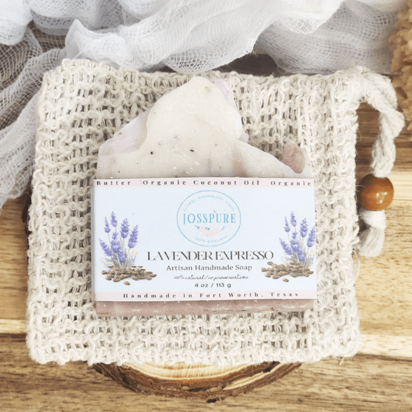 JOSSPURE lavender coffee mild shea butter soap bar wrapped in label on a textured cotton soap bag