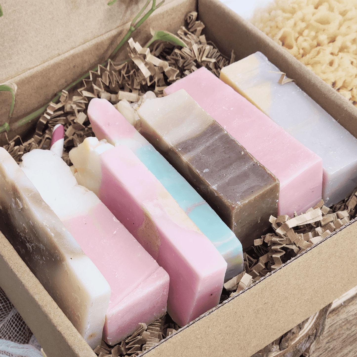 JOSSPURE handmade mystery soap sampler pack with colorful natural soap bars in a cardboard box