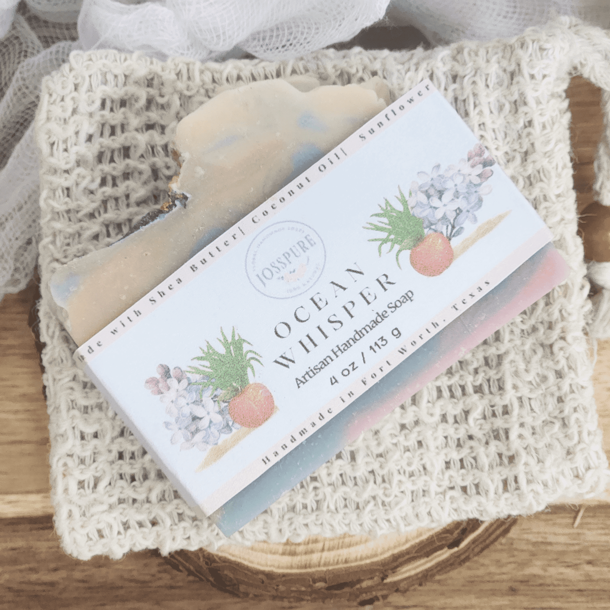 Ocean luxury mild shea butter soap bar with natural handmade packaging on a textured white cloth
