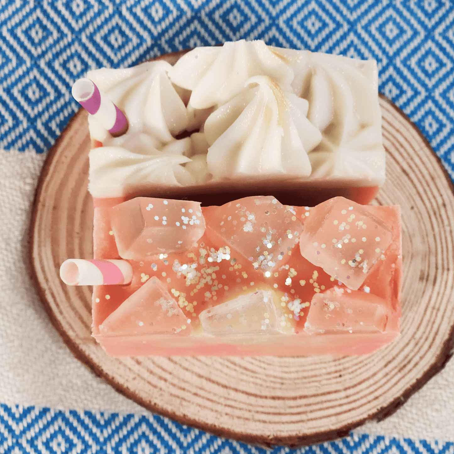 JOSSPURE raspberry lemonade mild shea butter soap handmade with decorative icing and glitter on wooden plate