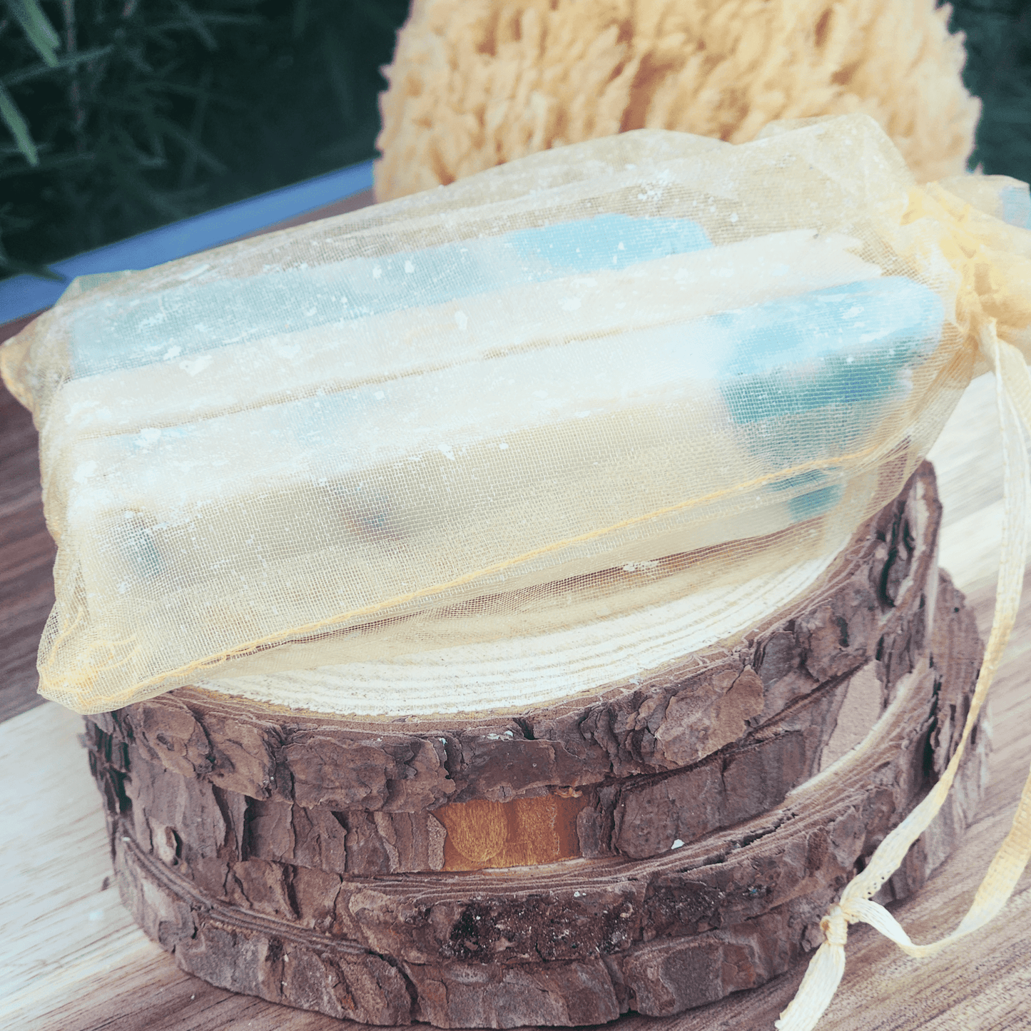 JOSSPURE handmade soap sampler gift set in a sheer drawstring pouch on wooden slices
