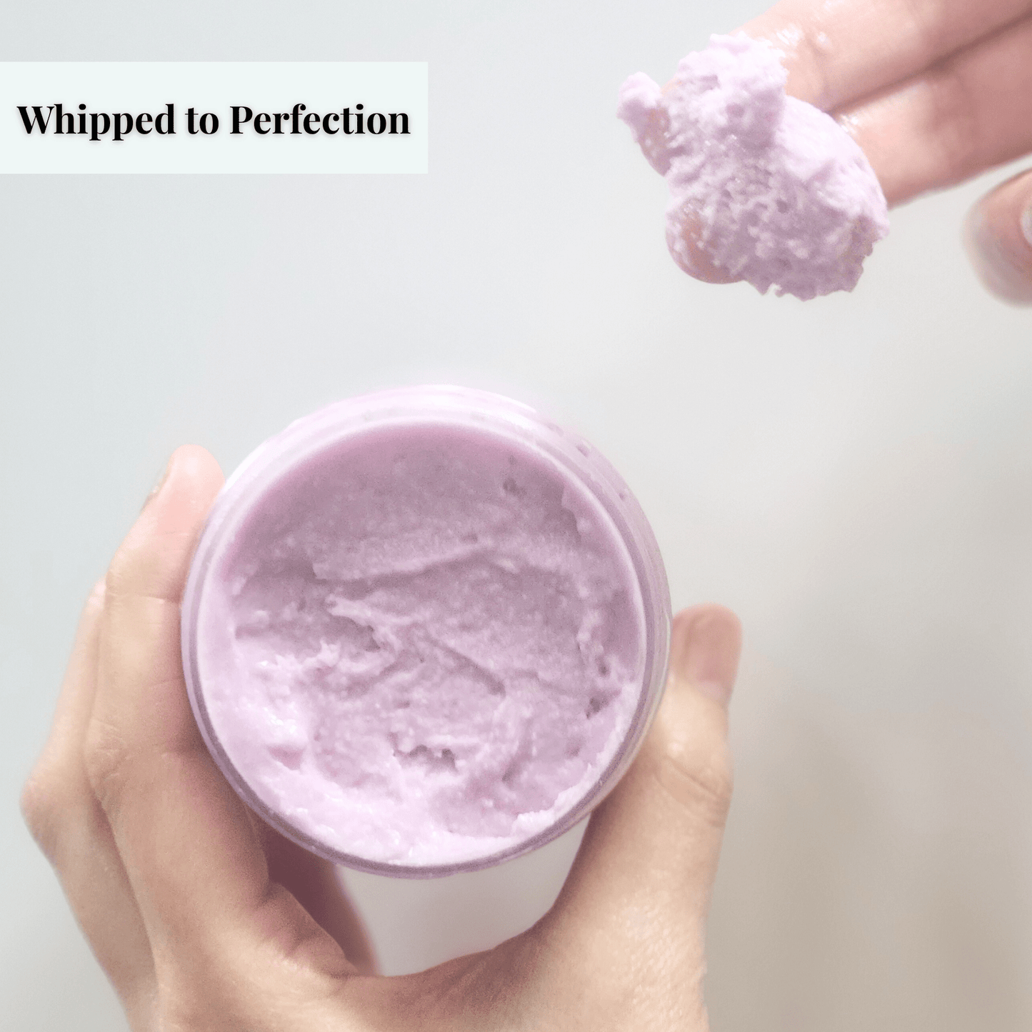 JOSSPURE lavender mango butter whipped body butter in container with scoop showing creamy texture