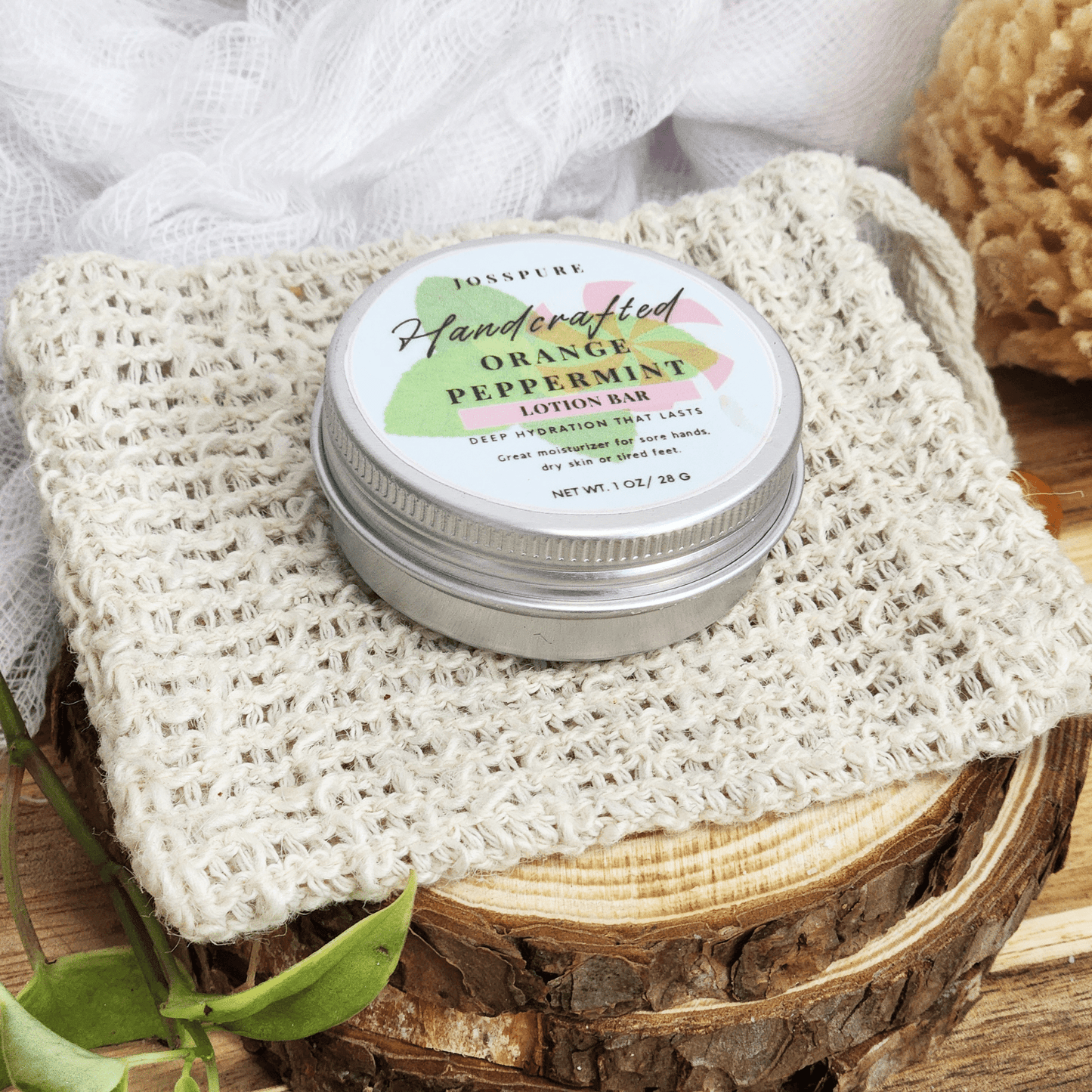 JOSSPURE peppermint orange Travel size mini lotion bar in metal tin on woven cloth and wood slice