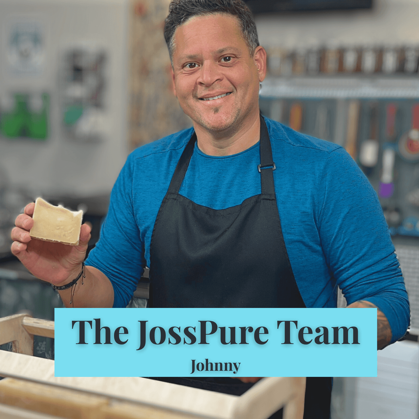 Man from JOSSPURE holding a bar of Green All Natural Soap in a handmade soap workshop