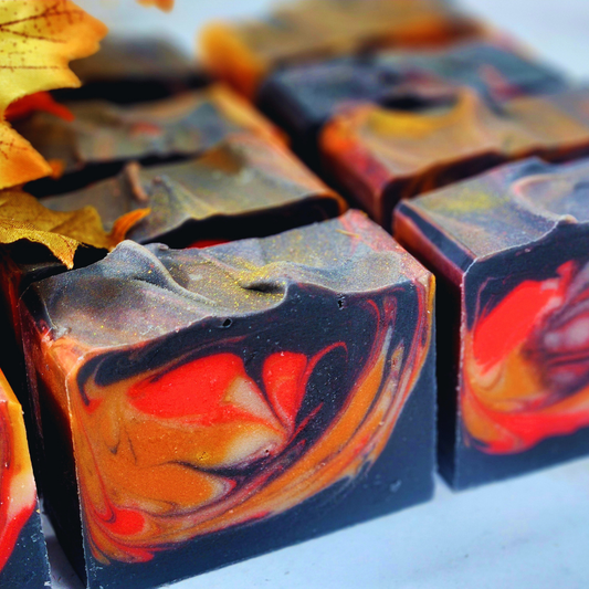 Bonfire Fall Soap featuring rich swirls of orange and black colors, perfect for autumn self-care and dry skin