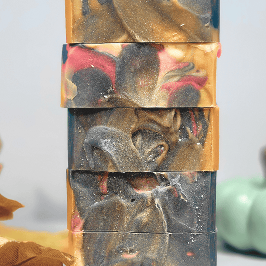 Artisan soaps in vibrant colors featured in the Fall Essentials Guide for women with dry skin