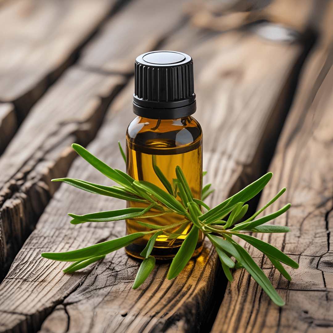 Amber bottle of tea tree oil with fresh green leaves on rustic wooden surface for tea tree for acne prone skin
