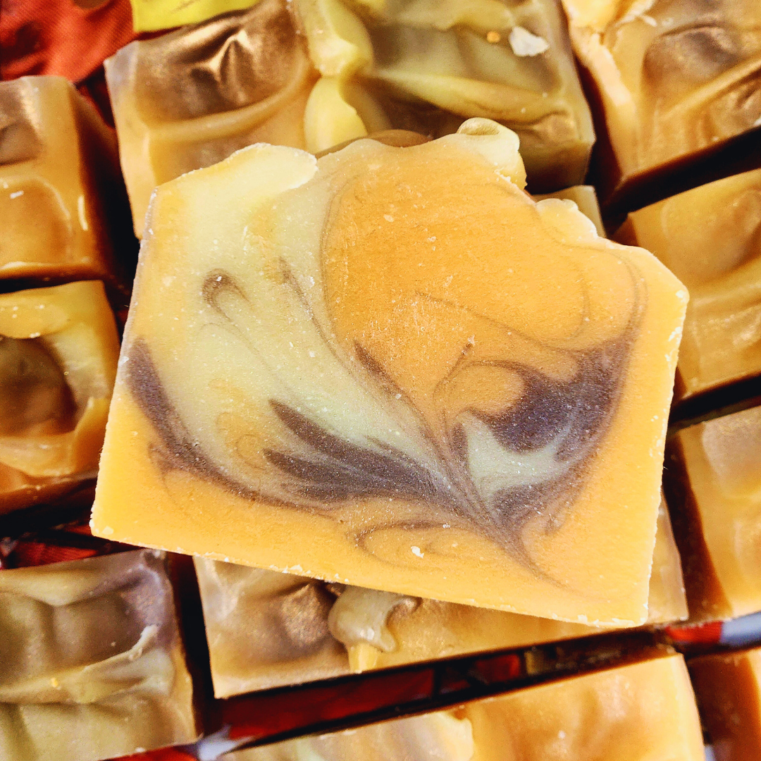 Close-up of swirled soap bars with brown and beige colors.