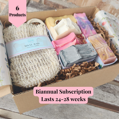 Handmade artisan soap bars in a subscription box with a sisal bag for natural body care