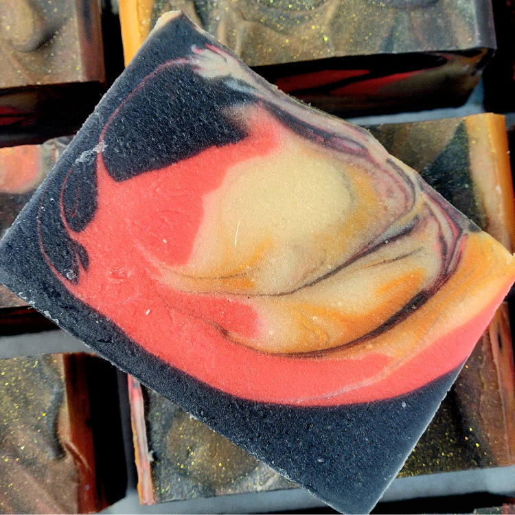 Handmade bonfire fall soap with a unique swirl of autumn colors and natural ingredients
