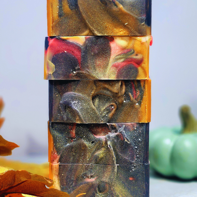 Stack of JOSSPURE bonfire fall soap bars with a unique swirl pattern, ideal for autumn skincare