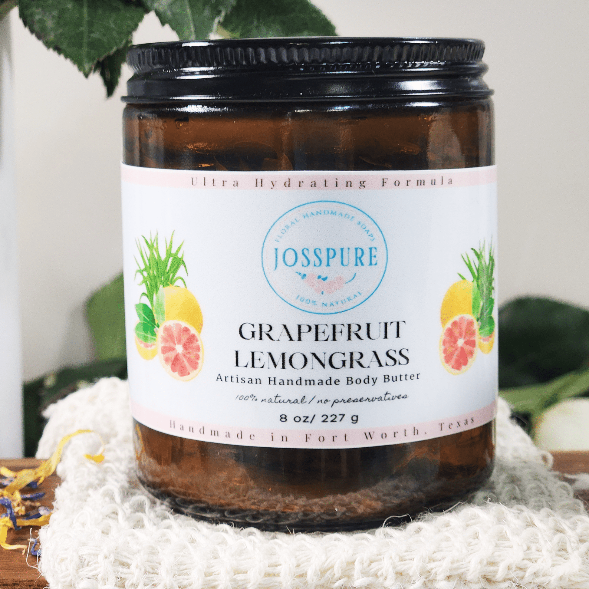 JOSSPURE grapefruit orange mango butter whipped body butter in a brown jar with white label and fruit illustrations
