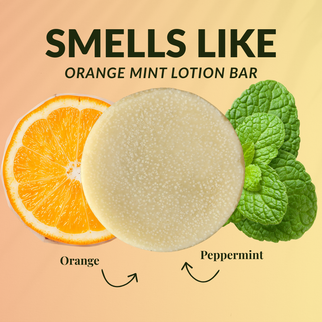 Peppermint orange travel size mini lotion bar surrounded by fresh orange and peppermint leaves