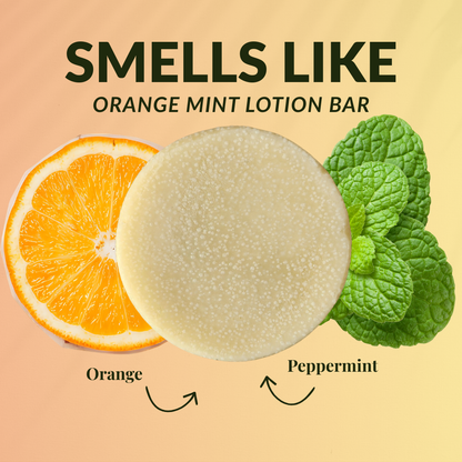 Peppermint orange travel size mini lotion bar surrounded by fresh orange and peppermint leaves