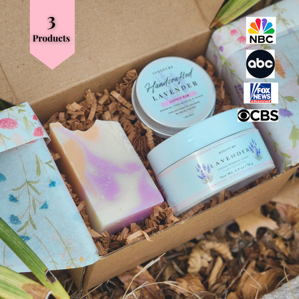 Travel size self-care bundle featuring lavender handmade soaps and body cream in eco-friendly packaging