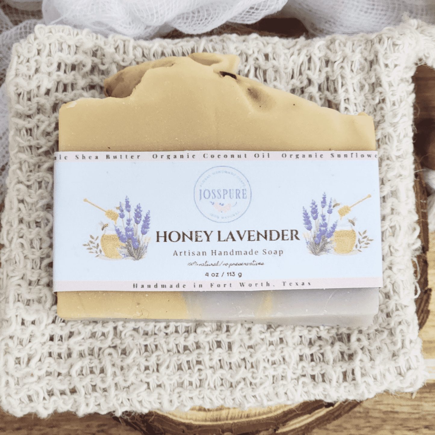 JOSSPURE honey lavender mild shea butter soap on a textured backdrop, showcasing its natural ingredients