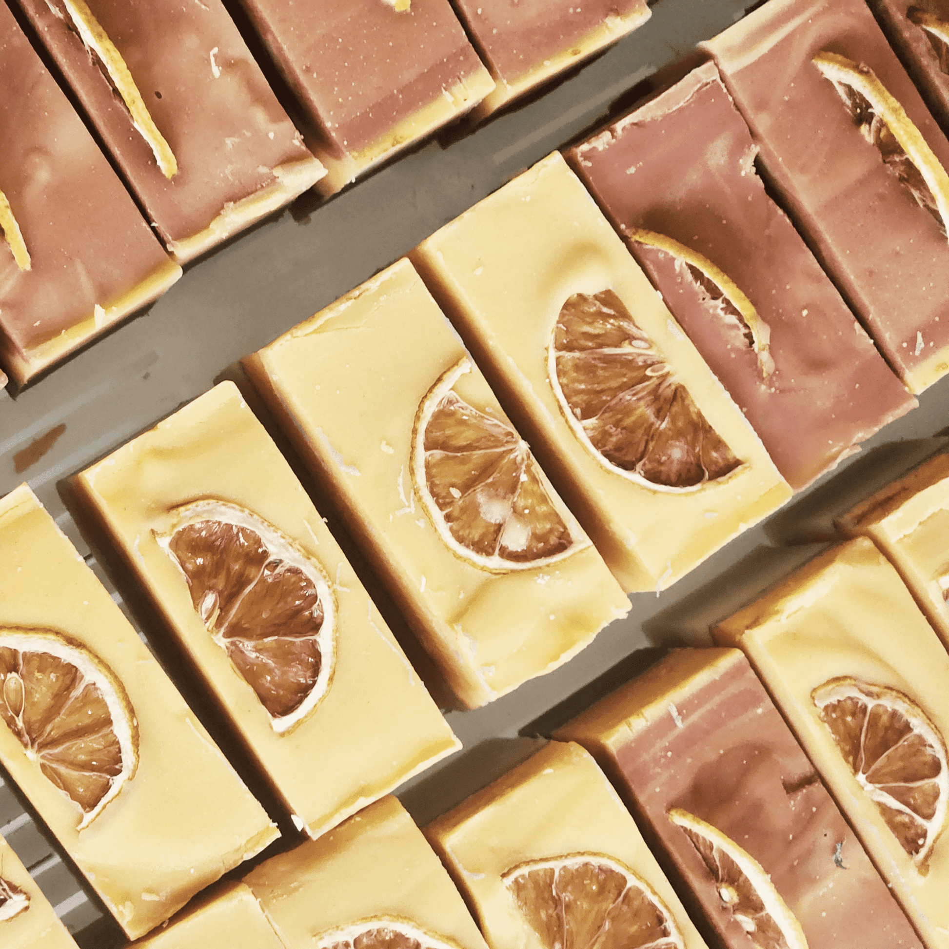 Handmade lemongrass mild shea butter soap bars decorated with dried citrus slices