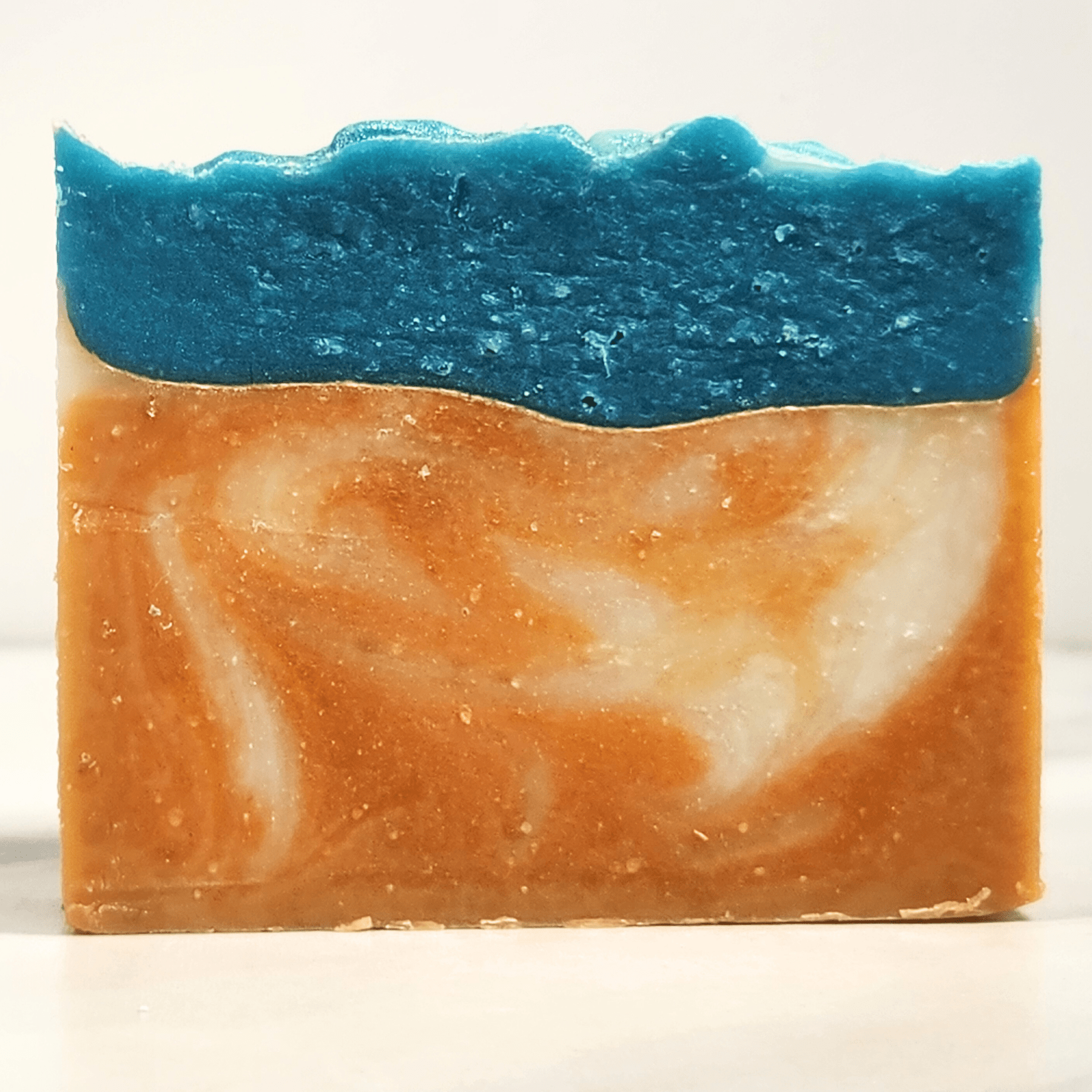 JOSSPURE handmade mango papaya shea butter soap with blue and orange swirls for natural skincare