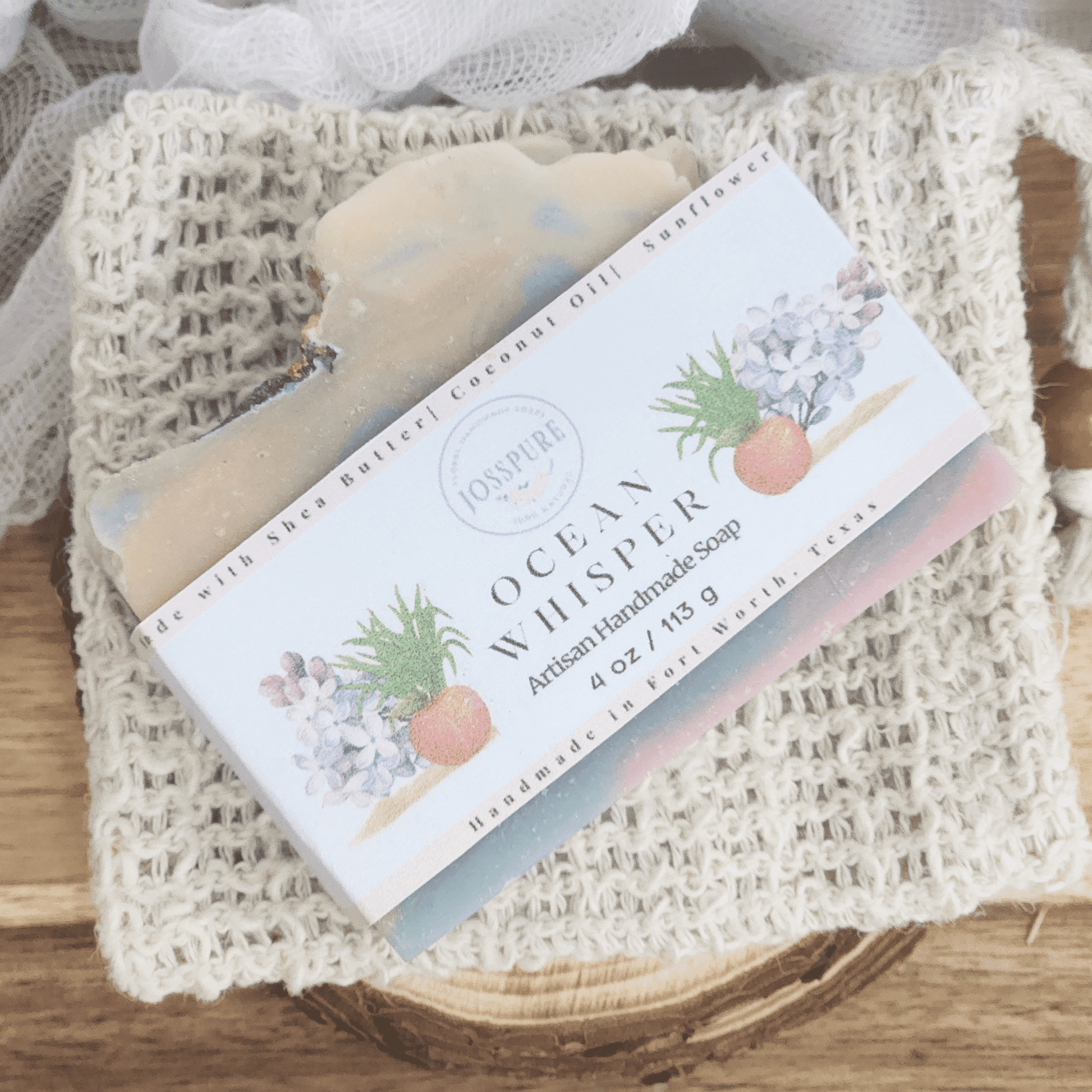 Ocean luxury mild shea butter soap bar with natural handmade packaging on a textured white cloth