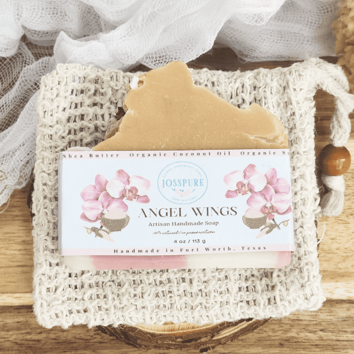Orchid sea salt mild shea butter soap Angel Wings handmade bar with floral label on woven soap pouch