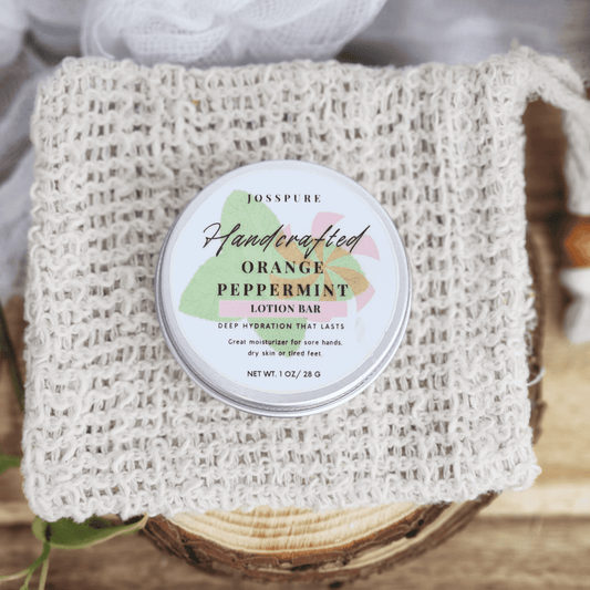 JOSSPURE peppermint orange Travel size mini lotion bar in a round tin on a woven natural cloth