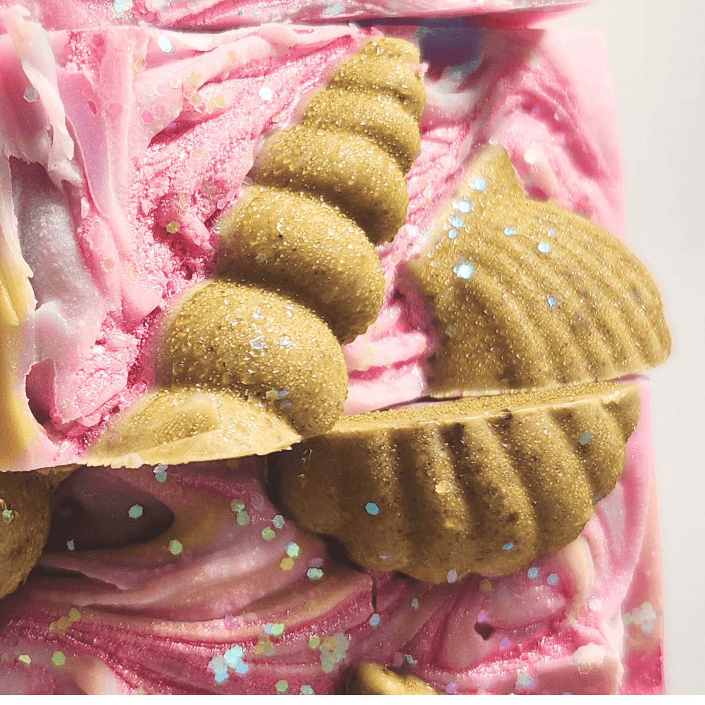 JOSSPURE handmade sea salt shea butter summer soap with pink swirls and seashell decorations