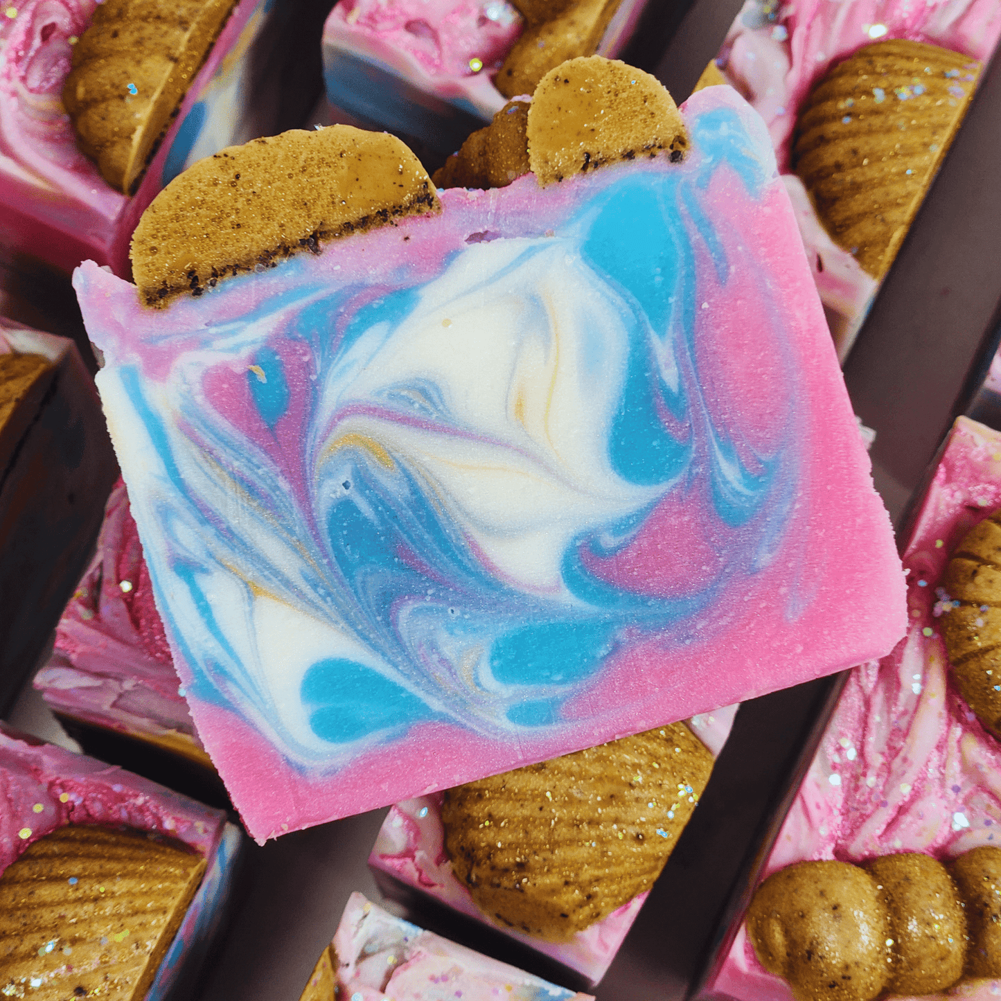 Handmade sea salt shea butter summer soap with colorful swirls and decorative brown accents