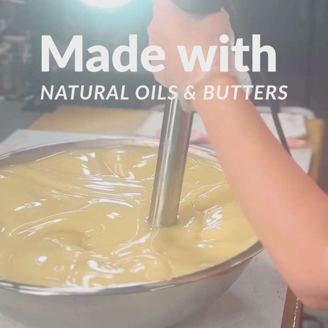 soapmaker using a big stick blender