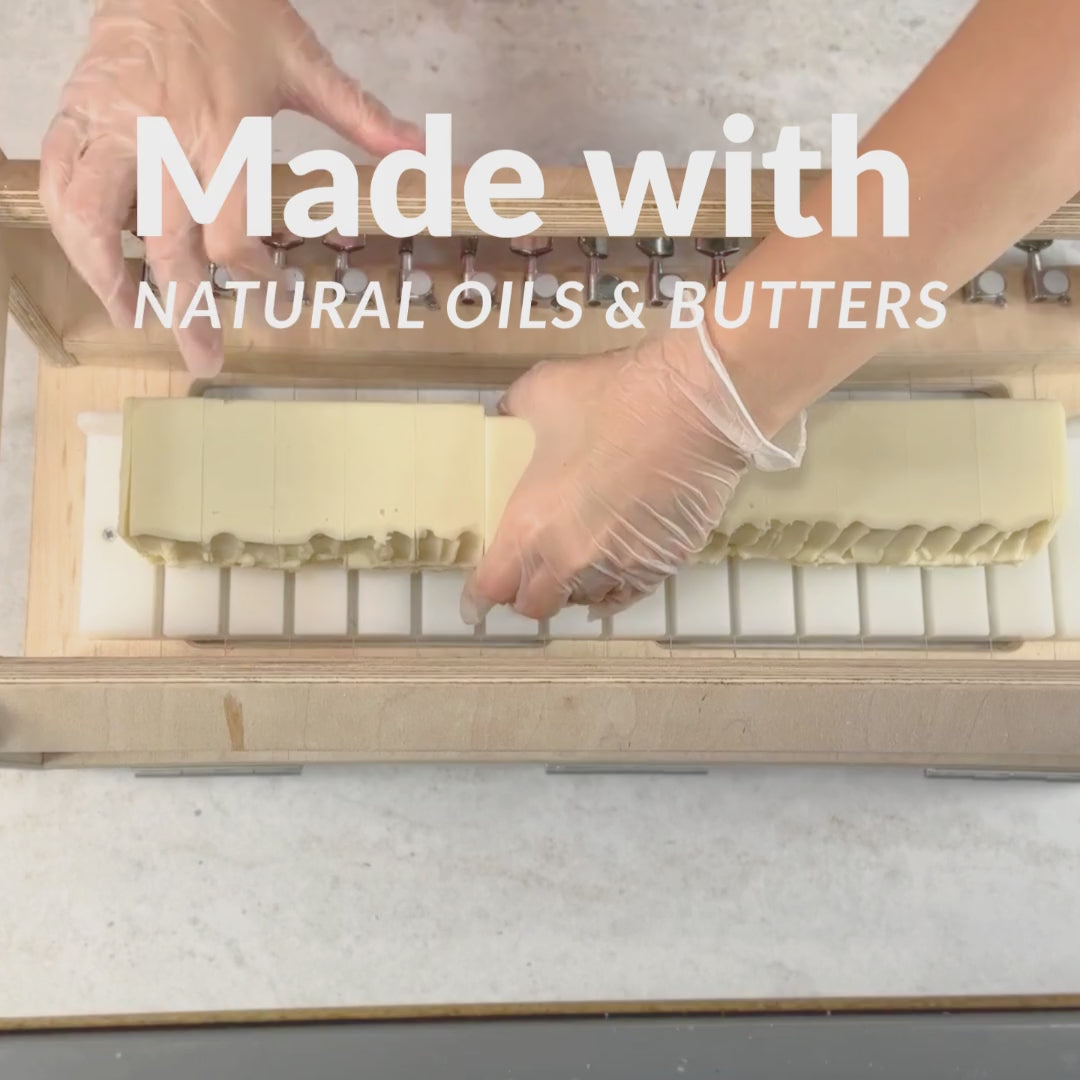 soapmaker cutting some artisan  tallow soap