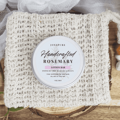 JOSSPURE rosemary travel size mini lotion bar in a round container on a woven cloth