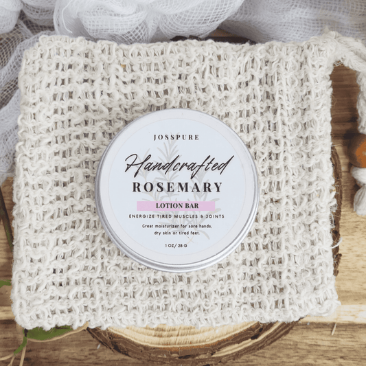 JOSSPURE rosemary travel size mini lotion bar in a round container on a woven cloth